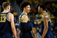 Moritz Wagner (13), D.J. Wilson (5), and Zak Irvin (21)