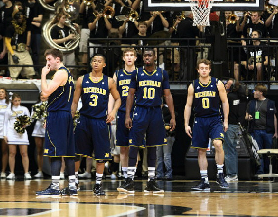 Stu Douglass (1), Trey Burke (3), Evan Smotrycz (23), Tim Hardaway Jr. (10), and Zack Novak (0)