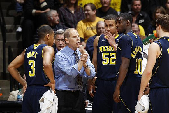 Trey Burke (3), Jeff Meyer, John Beilein, Jordan Morgan (52), Tim Hardaway Jr. (10), and Zack Novak (0)