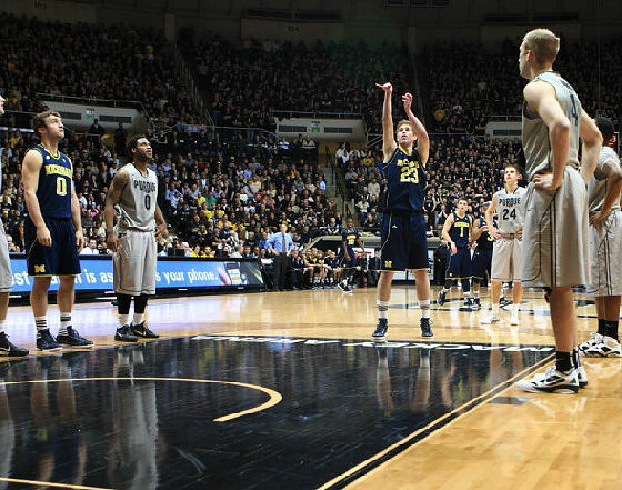 Zack Novak (0) and Evan Smotrycz (23)