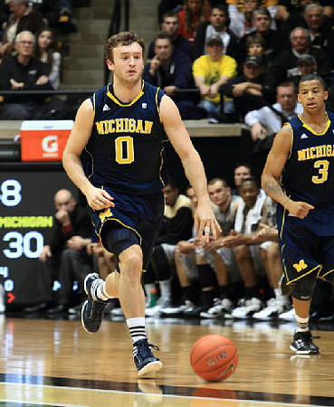 Zack Novak (0) and Trey Burke (3)