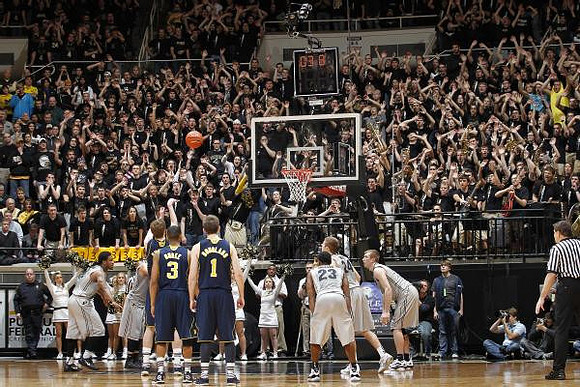 Evan Smotrycz (23), Trey Burke (3), and Stu Douglass (1)