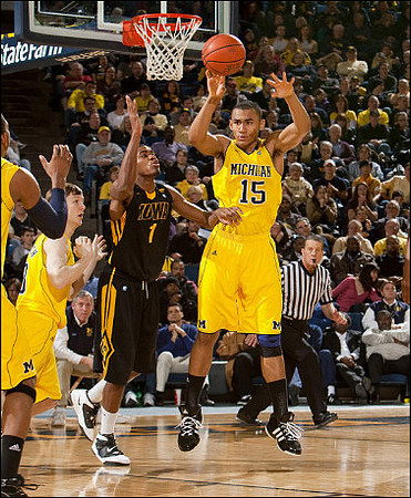 Matt Vogrich (13) and Jon Horford (15)