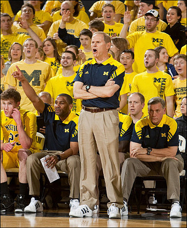 Evan Smotrycz (23), LaVall Jordan, John Beilein, and Jeff Meyer