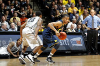 Trey Burke (3) and John Beilein