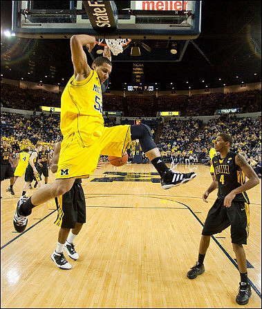 Jordan Morgan (52) and Darius Morris (4)