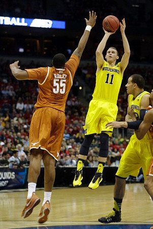 Nik Stauskas (11) and Jordan Morgan (52)