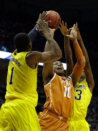 Glenn Robinson III (1) and Caris LeVert (23)