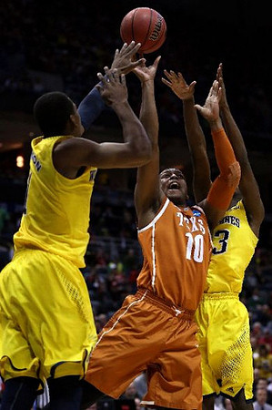 Glenn Robinson III (1) and Caris LeVert (23)