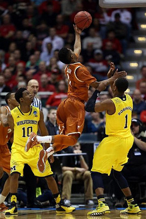 Derrick Walton Jr. (10) and Glenn Robinson III (1)
