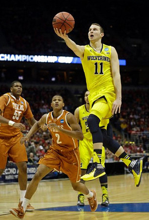 Nik Stauskas (11) and Jordan Morgan (52)