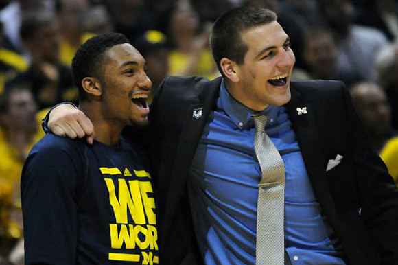 Zak Irvin (21) and Mitch McGary (4)