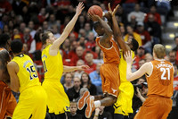 Jon Horford (15), Nik Stauskas (11), and Zak Irvin (21)