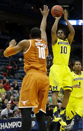Derrick Walton Jr. (10) and Glenn Robinson III (1)