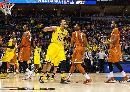 Glenn Robinson III (1), Caris LeVert (23), and Jordan Morgan (52)