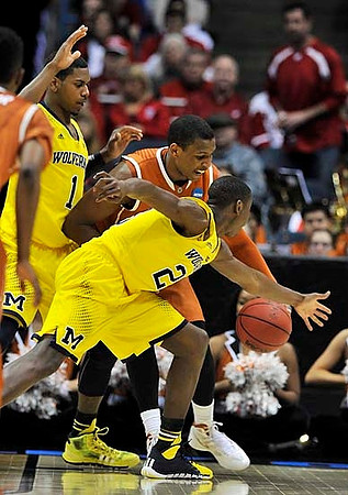 Glenn Robinson III (1) and Caris LeVert (23)
