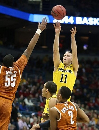 Nik Stauskas (11) and Jordan Morgan (52)