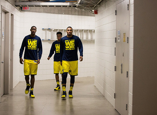 Caris LeVert (23), Derrick Walton Jr. (10), and Zak Irvin (21)