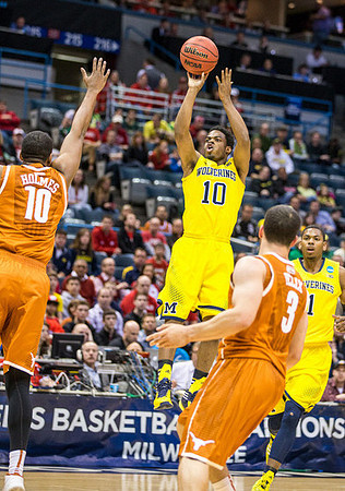 Derrick Walton Jr. (10) and Glenn Robinson III (1)