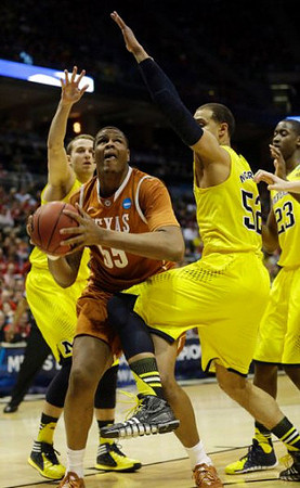 Nik Stauskas (11), Jordan Morgan (52), and Caris LeVert (23)
