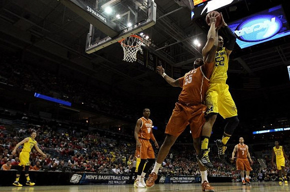 Jordan Morgan (52), Nik Stauskas (11), and Caris LeVert (23)