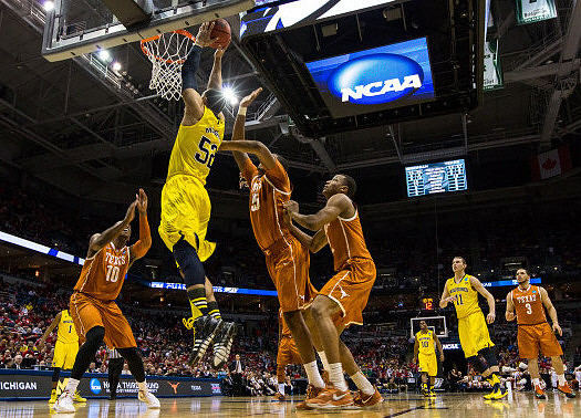 Jordan Morgan (52), Glenn Robinson III (1), Derrick Walton Jr. (10), and Nik Stauskas (11)