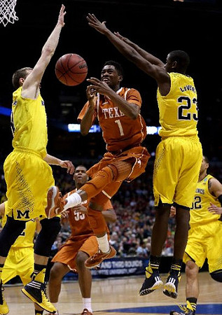 Nik Stauskas (11), Caris LeVert (23), and Jordan Morgan (52)