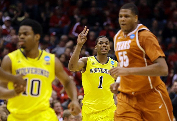 Derrick Walton Jr. (10) and Glenn Robinson III (1)