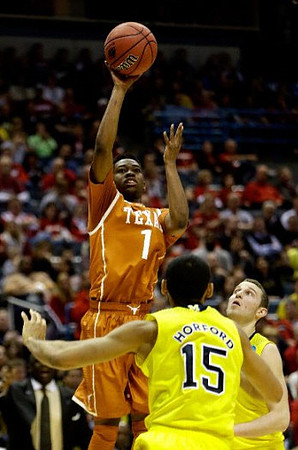 Jon Horford (15) and Nik Stauskas (11)