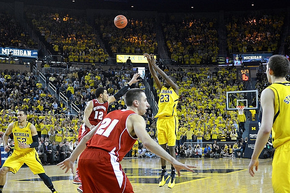 Jordan Morgan (52), Caris LeVert (23), and Nik Stauskas (11)