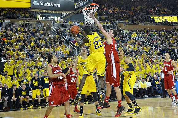 Glenn Robinson III (1), Caris LeVert (23), and Jordan Morgan (52)