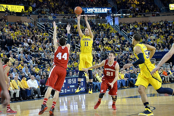 Nik Stauskas (11) and Jordan Morgan (52)