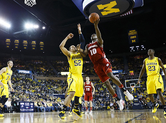 Nik Stauskas (11), Jordan Morgan (52), and Caris LeVert (23)