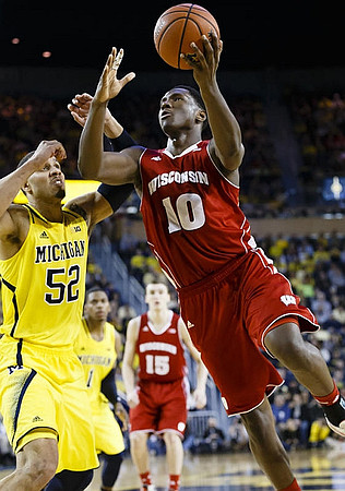Jordan Morgan (52) and Glenn Robinson III (1)