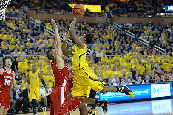 Glenn Robinson III (1) and Derrick Walton Jr. (10)