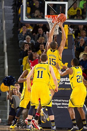 Nik Stauskas (11), Jon Horford (15), and Zak Irvin (21)