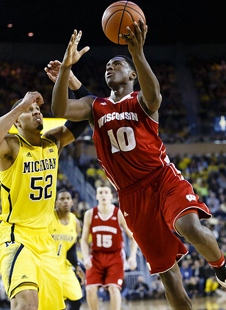 Jordan Morgan (52) and Glenn Robinson III (1)
