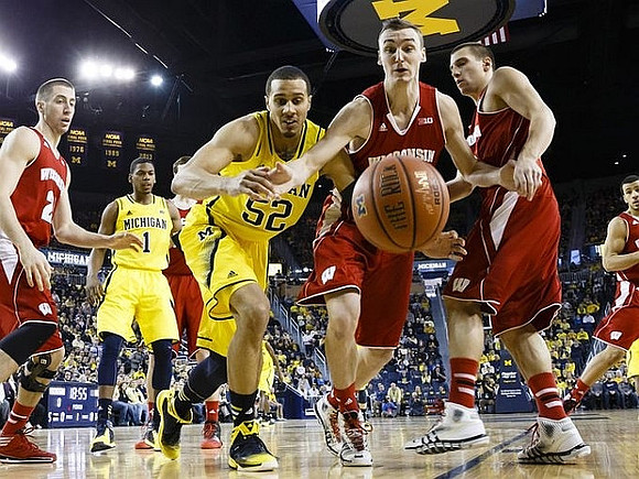 Glenn Robinson III (1) and Jordan Morgan (52)