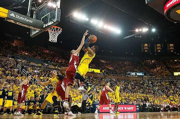 Glenn Robinson III (1), Jordan Morgan (52), and Caris LeVert (23)