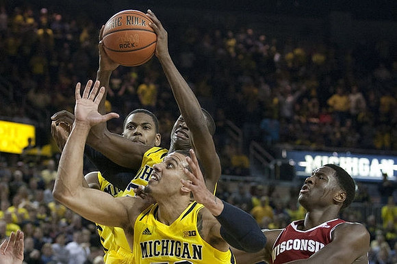 Glenn Robinson III (1), Caris LeVert (23), and Jordan Morgan (52)