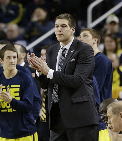 Andrew Dakich (5), Mitch McGary (4), Bacari Alexander, and John Beilein