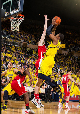 Jordan Morgan (52), Glenn Robinson III (1), and Caris LeVert (23)