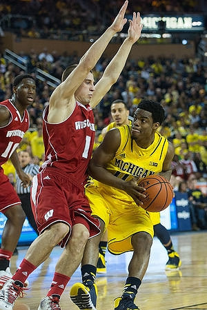 Derrick Walton Jr. (10) and Jordan Morgan (52)