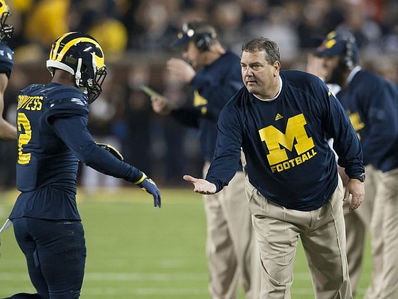 Blake Countess (2) and Brady Hoke