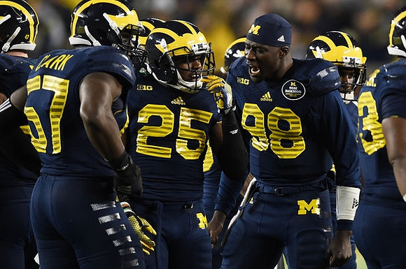 Frank Clark (57), Dymonte Thomas (25), and Devin Gardner (98)