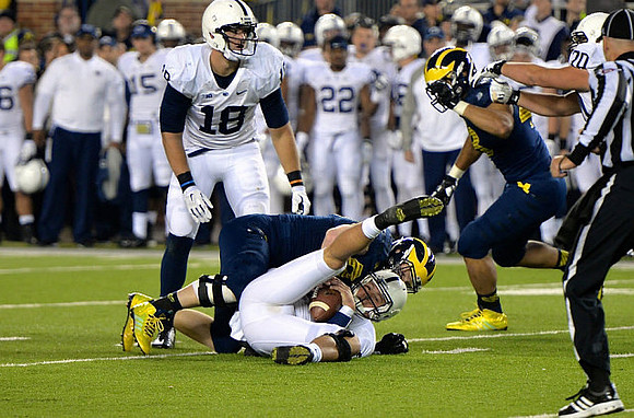 Brennen Beyer (97) and Chris Wormley (43)