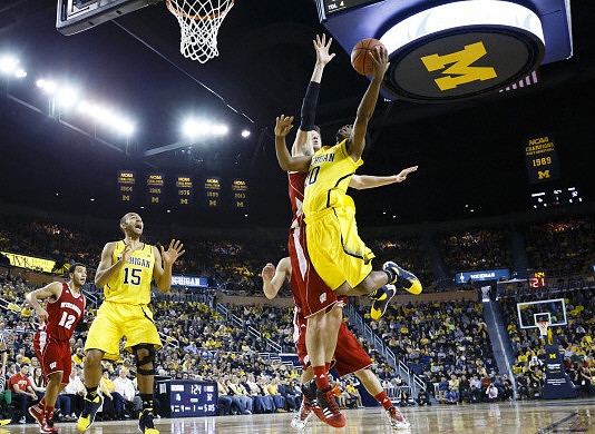 Jon Horford (15) and Derrick Walton Jr. (10)