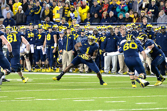 Graham Glasgow (61), Devin Funchess (1), and Jack Miller (60)