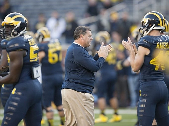Frank Clark (57), Brady Hoke, and Will Hagerup (40)