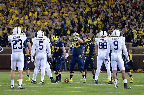 Kyle Kalis (67), Jack Miller (60), and De'Veon Smith (4)